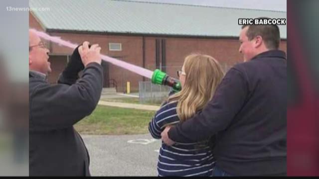 Moyock firefighter uses fire engine's hose for baby gender reveal